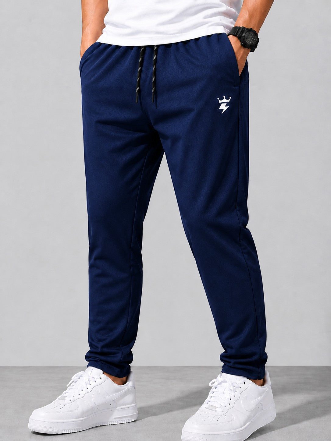 swagzaar men's dark blue slim-fit lycra track pants with an elastic drawstring waistband and side pockets.