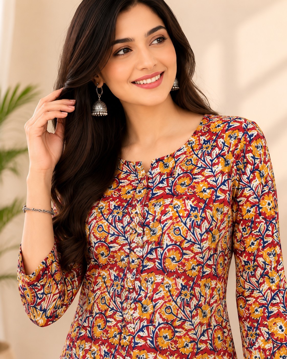 Swagzaar women's cotton kurta featuring a vibrant multi-colored floral print, round neckline, and three-quarter sleeves.