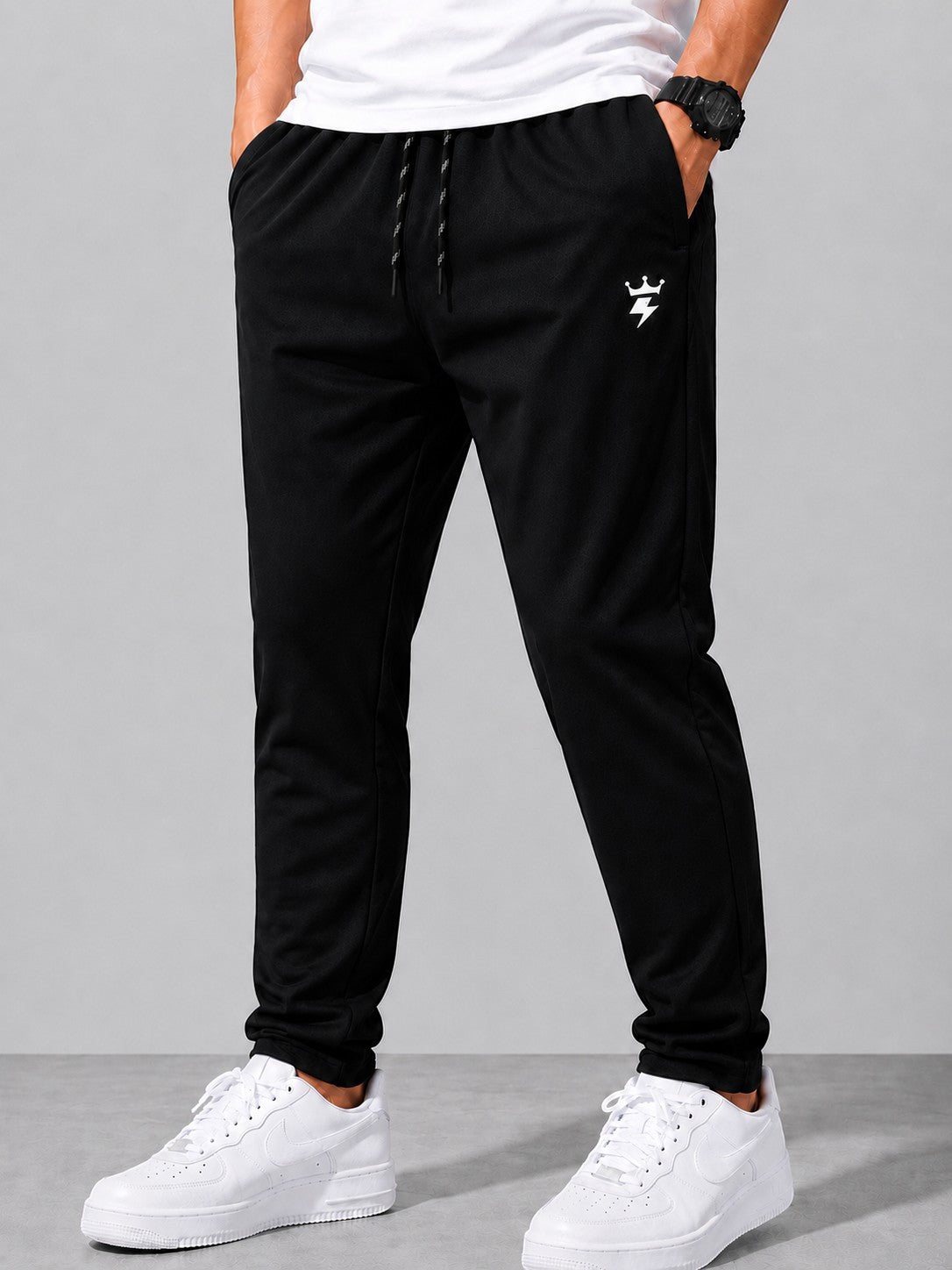 SWAGZAAR men's black lycra track pants with premium stretchable fabric, regular fit, zipper pockets and adjustable drawstring waist, ideal for gym, running, sports, workouts and everyday casual wear.