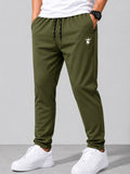 SWAGZAAR men's olive green lycra track pants with premium stretchable fabric, regular fit, zipper pockets and drawstring waist, ideal for gym, running, sports, workouts and everyday casual wear.