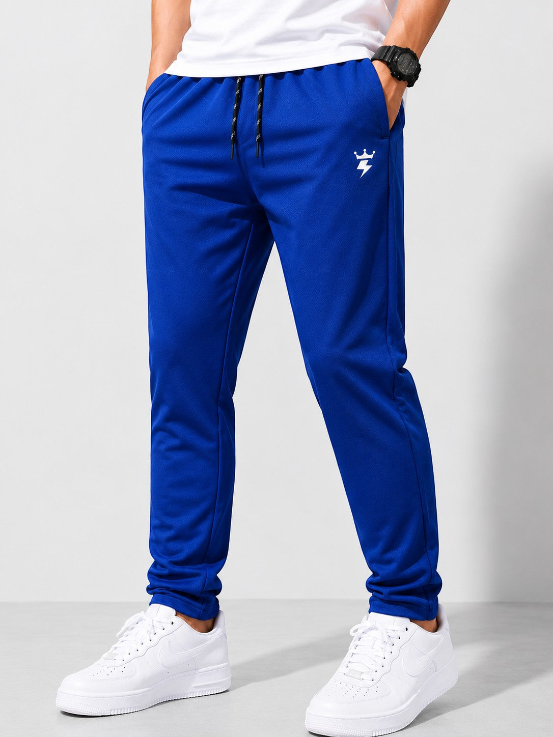 SWAGZAAR men's royal blue lycra track pants with premium stretchable fabric, regular fit, drawstring waist and zipper pockets, ideal for gym, running, sports, workouts and everyday casual wear.